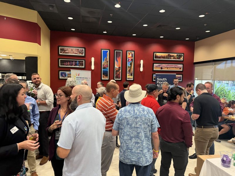Meetup guests connecting over AI and business.