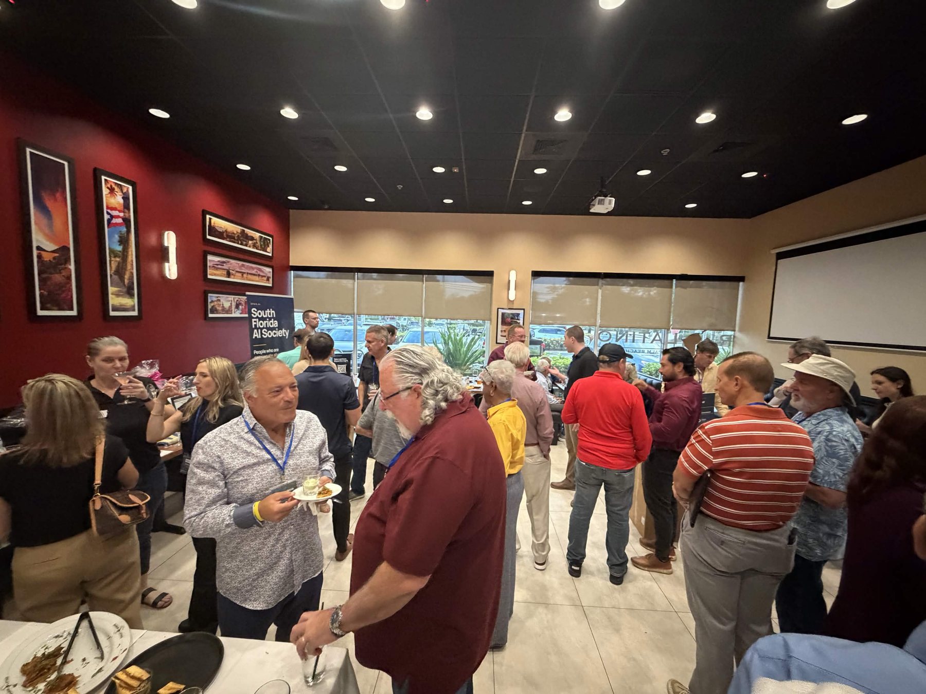 Guests sharing ideas at the South Florida AI Society meetup.